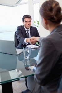 Portrait of a manager interviewing a female applicant